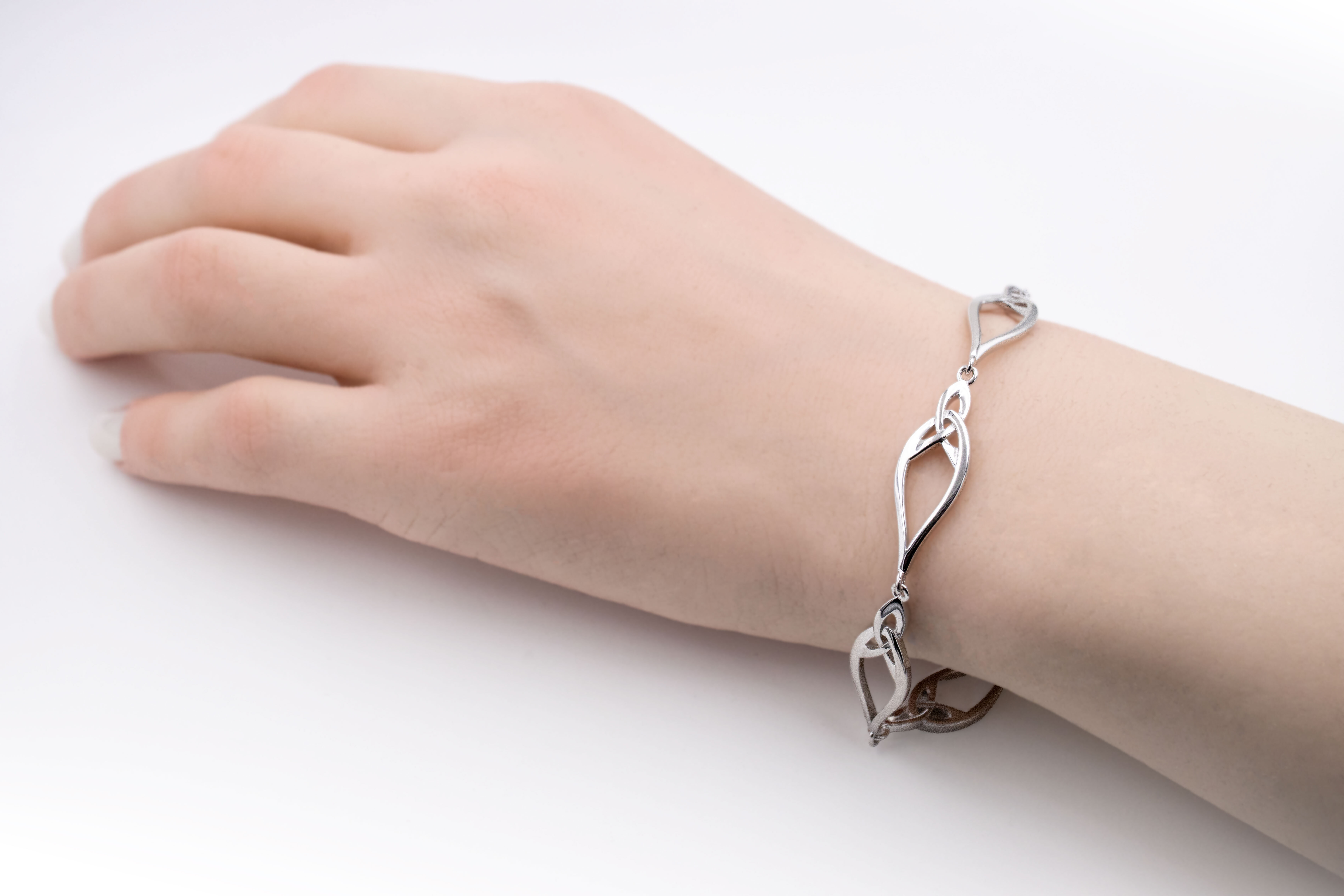 Striking Sterling Silver Trinity Knot Bracelet For Women - Model Photo