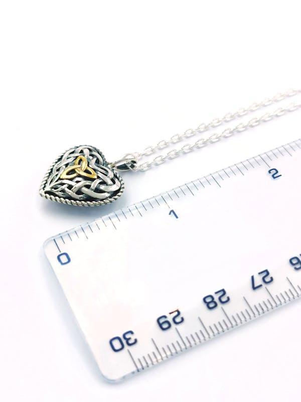 Irish Sterling Silver Trinity Knot & Celtic Knot Necklace For Women With a Oxidized Finish. Picture For Scale.