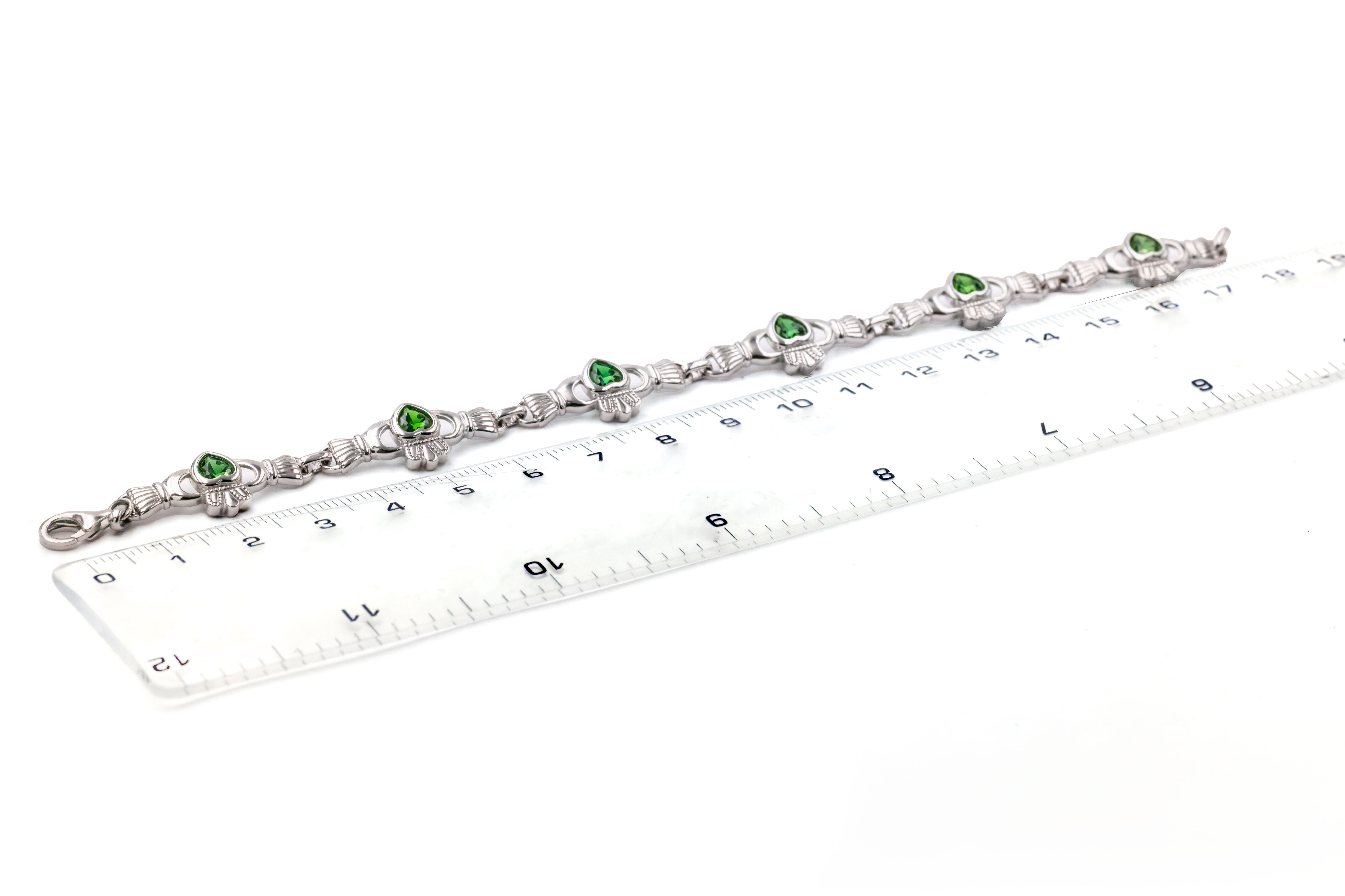 Attractive Sterling Silver Claddagh Bracelet For Women With a Polished Finish. Picture For Scale.