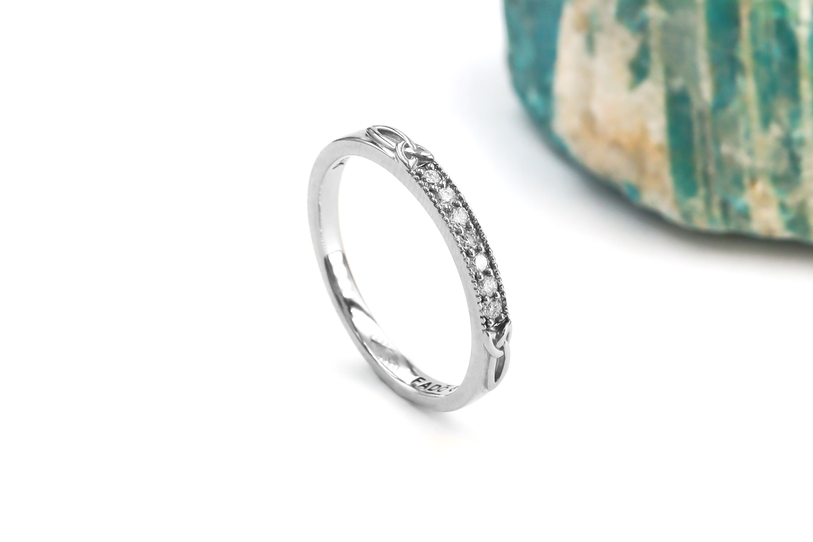 Womens Trinity Knot Wedding Ring in Platinum 950 With a Polished Finish. Side View.