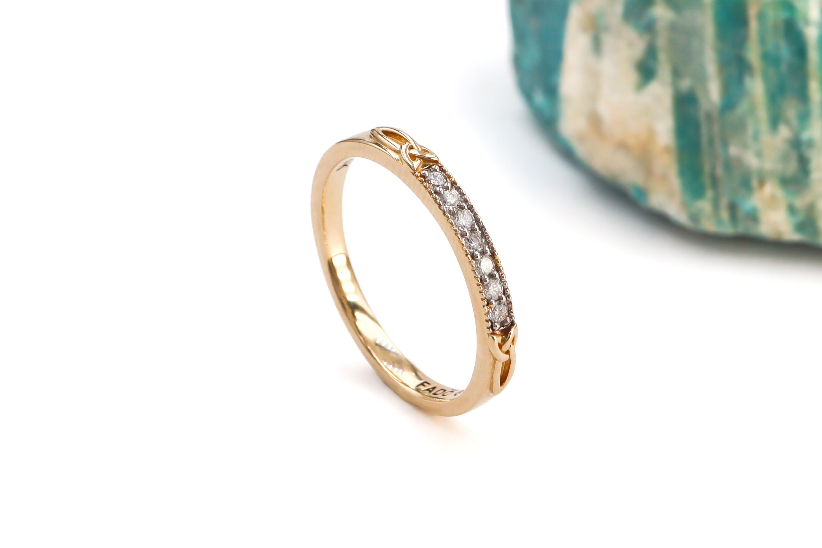 Luxurious 14K Yellow Gold Trinity Knot Ring For Women With a Polished Finish. Side View.