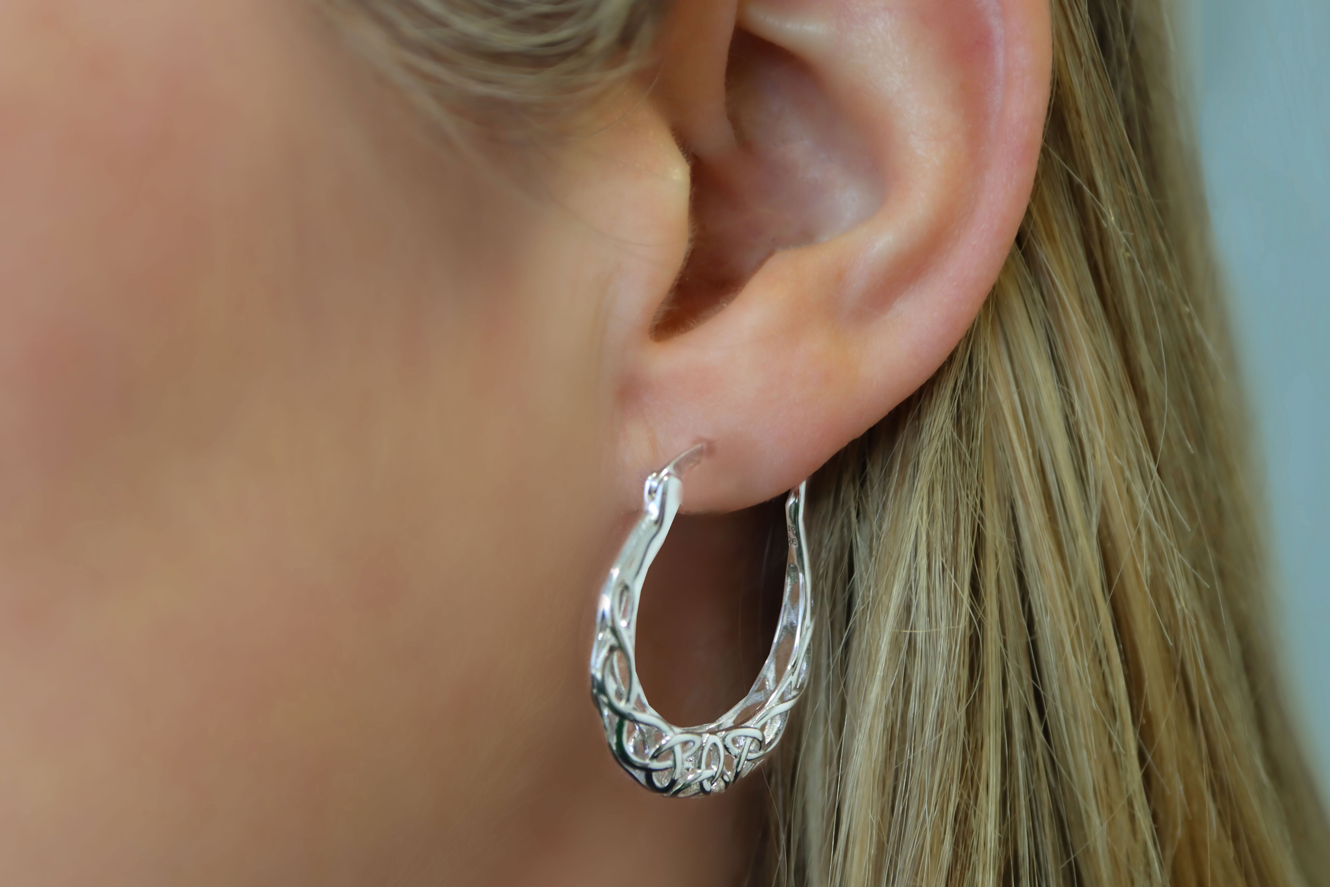 Womens Polished Sterling Silver Trinity Knot Earrings - Model Photo