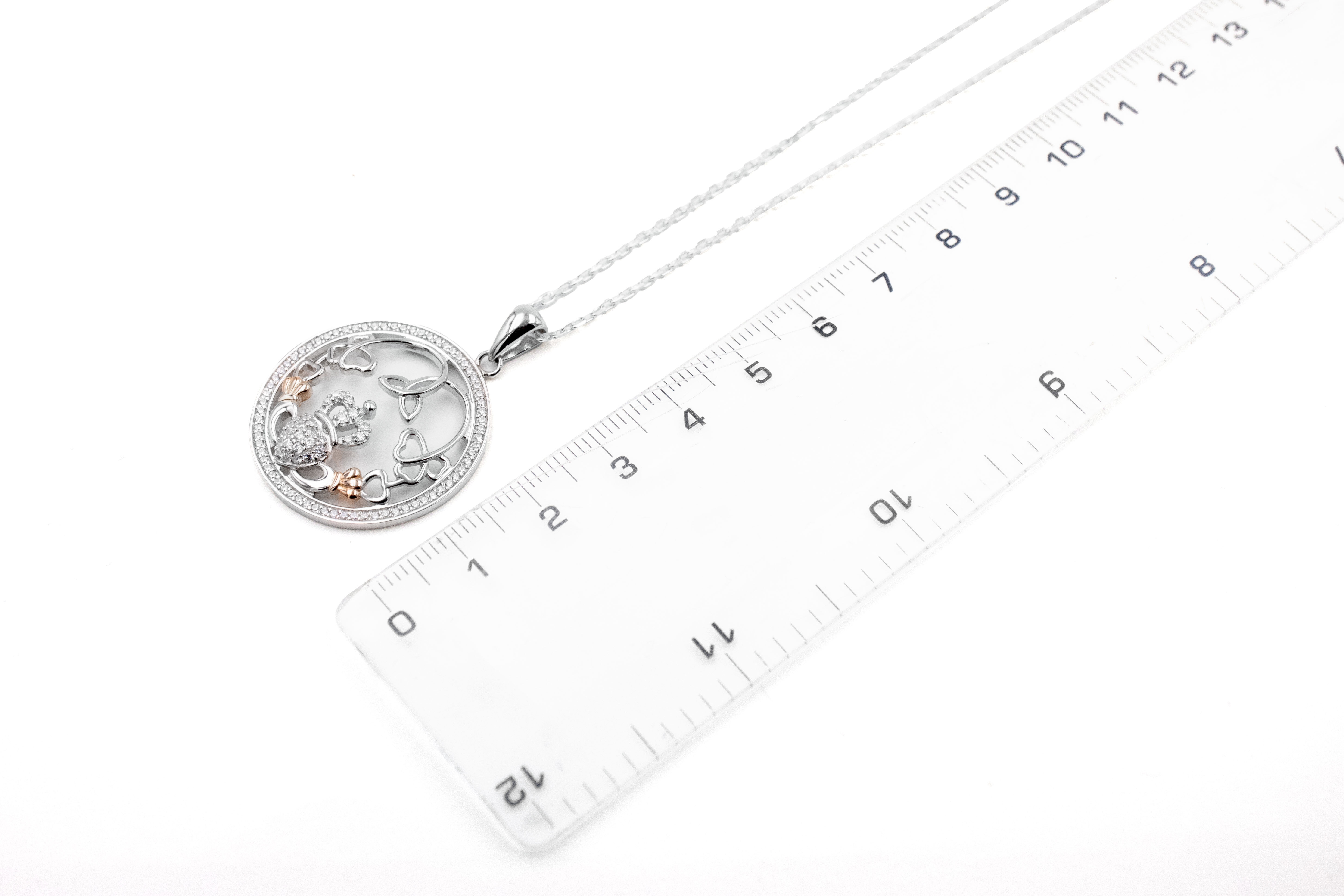 Womens Claddagh Necklace in Sterling Silver. Picture For Scale.