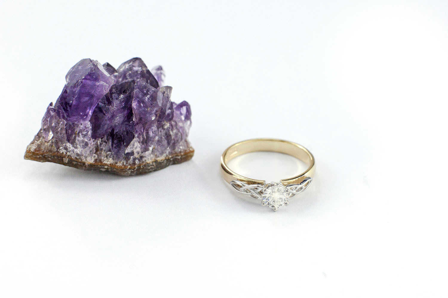 Striking Yellow Gold & White Gold Trinity Knot Ring For Women With a Polished Finish