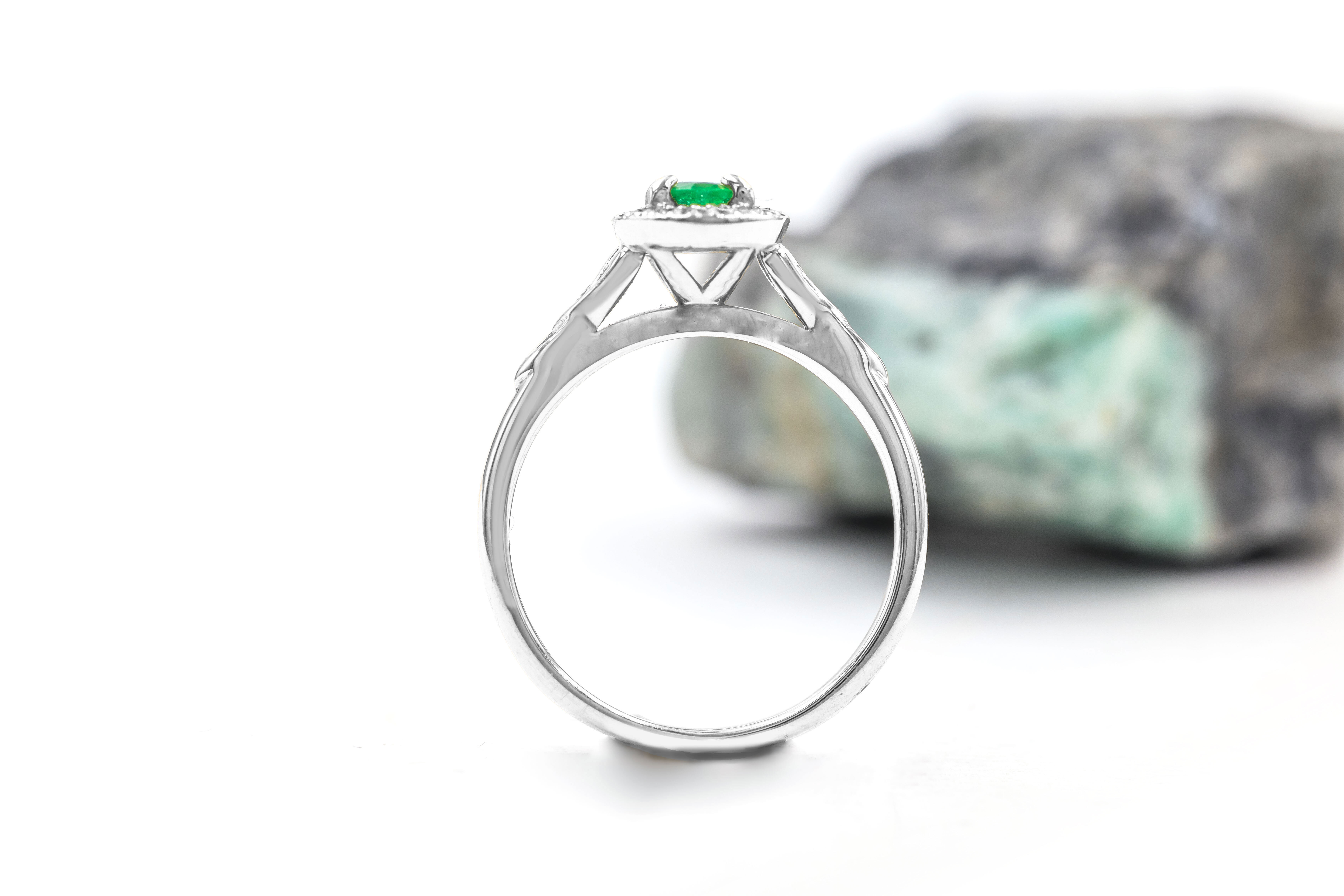 Luxurious Platinum 950 Trinity Knot 0.50ct Natural Emerald Ring With a Polished Finish For Women. Side View.