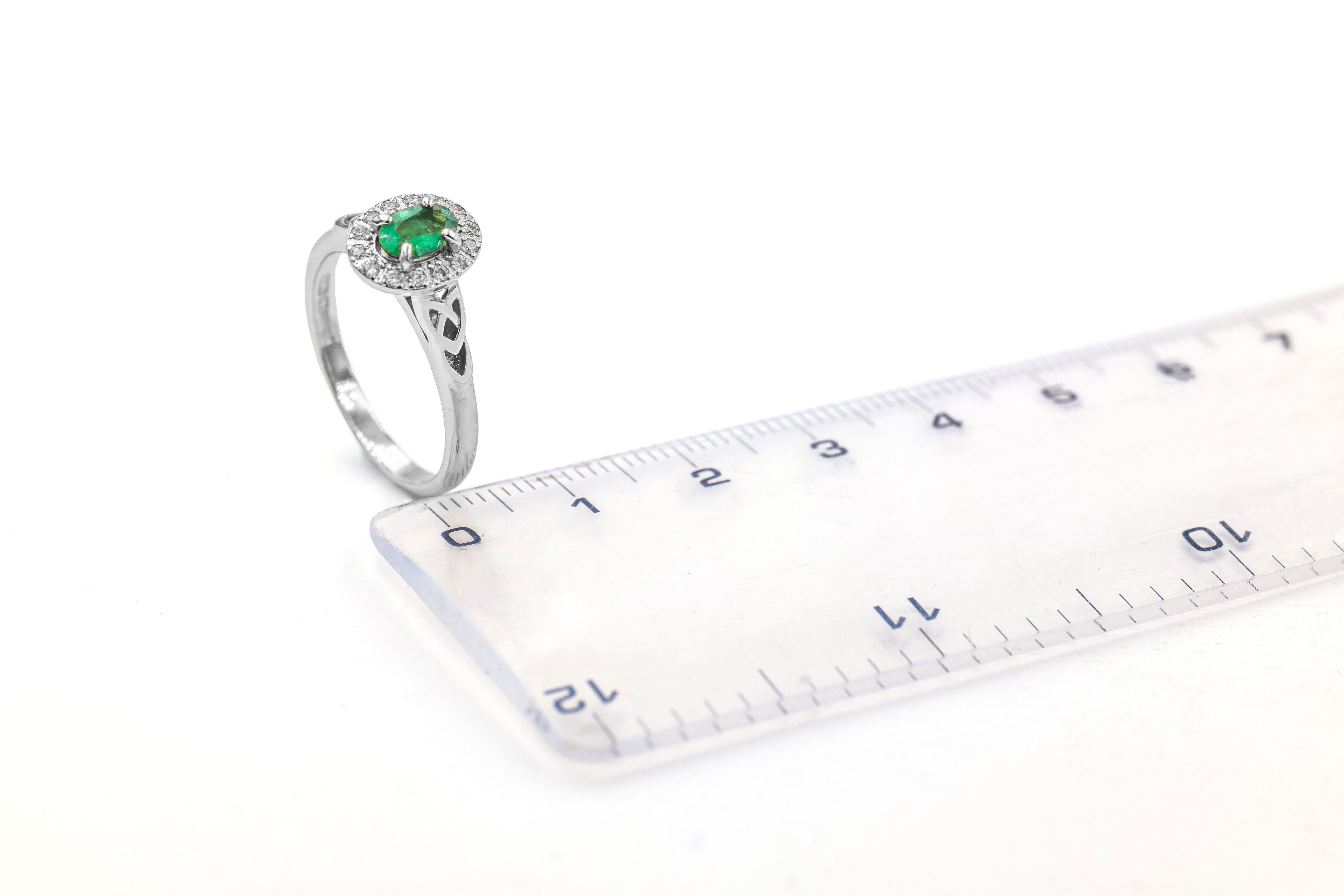 Womens Polished Trinity Knot & Celtic Knot 0.50ct Natural Emerald Engagement Ring in Real Platinum 950. Picture For Scale.