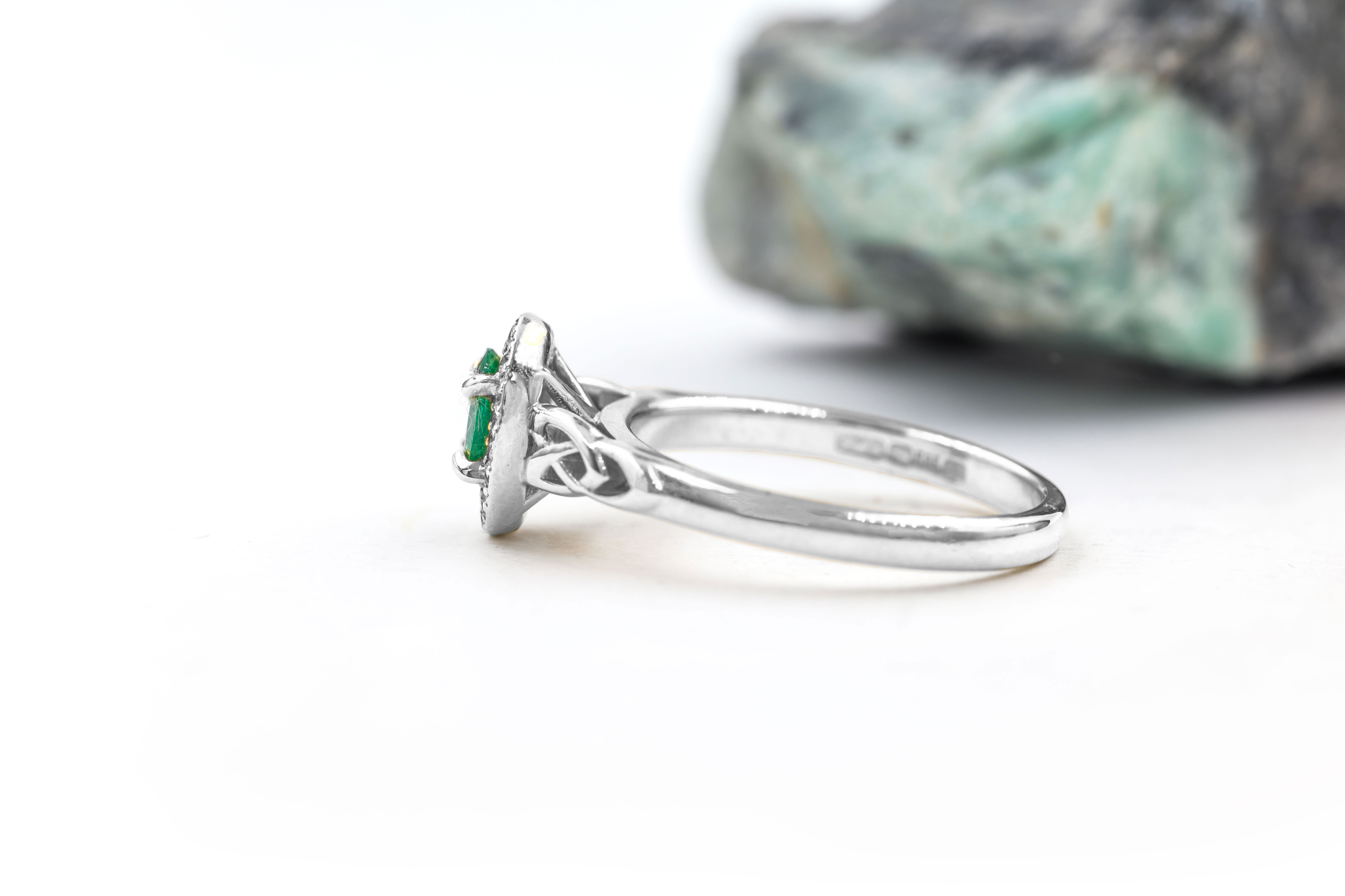 Irish Platinum 950 Trinity Knot 0.50ct Natural Emerald Ring For Women With a Polished Finish. Side View.