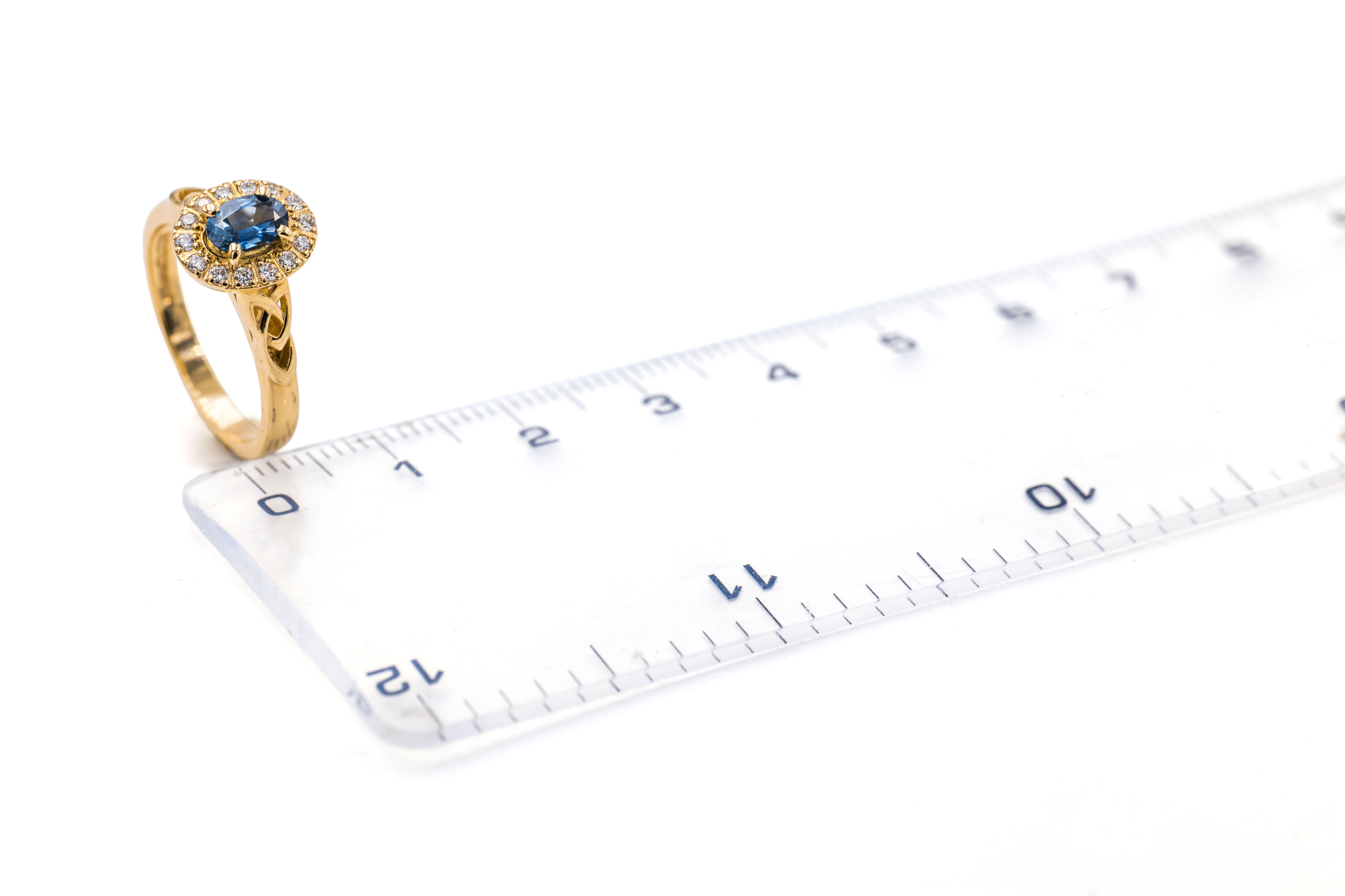 Womens Trinity Knot Engagement Ring in 18K Yellow Gold. Picture For Scale.