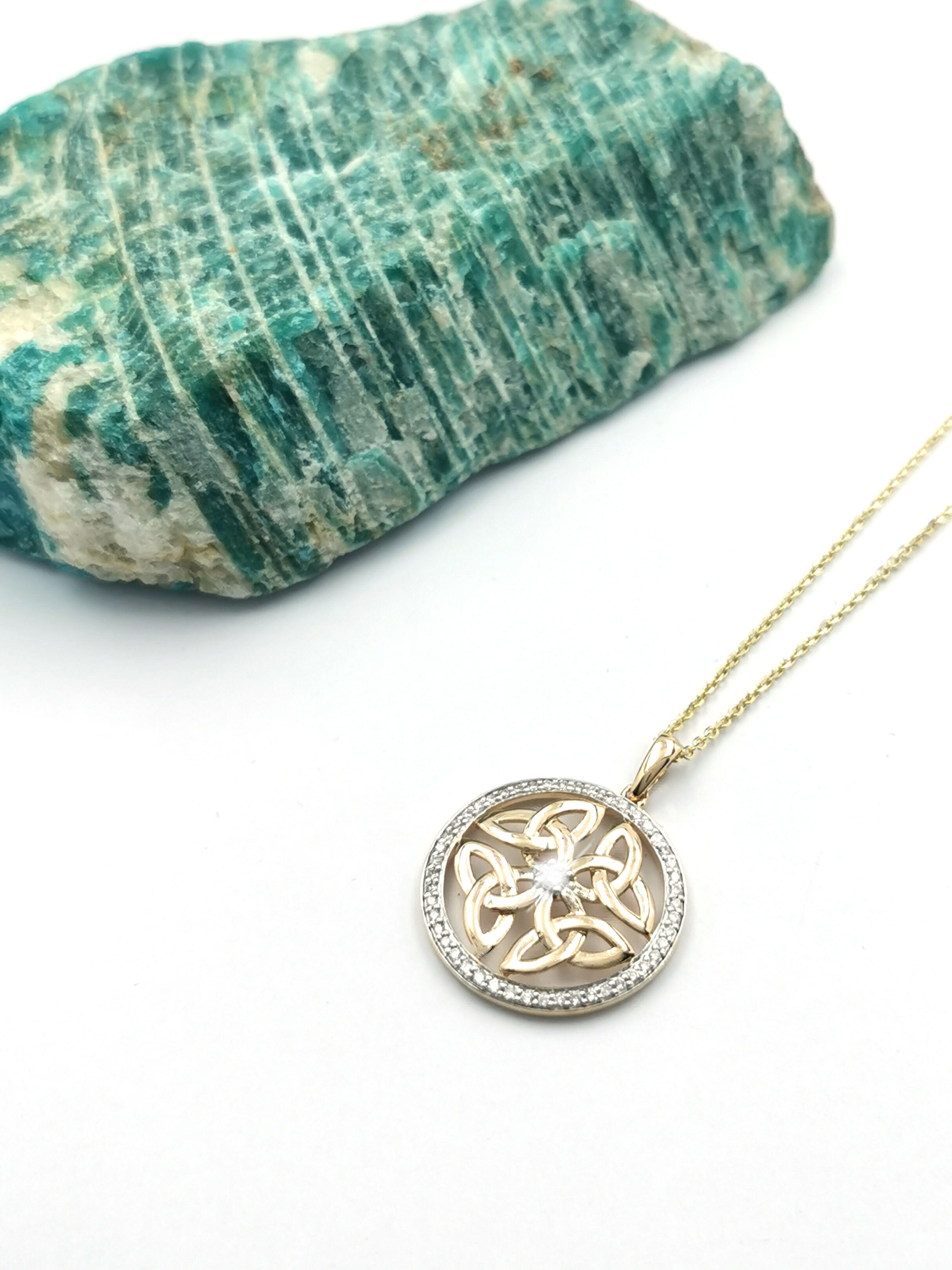 Luxurious Yellow Gold Trinity Knot & Celtic Knot Necklace For Women. Pictured Flat.