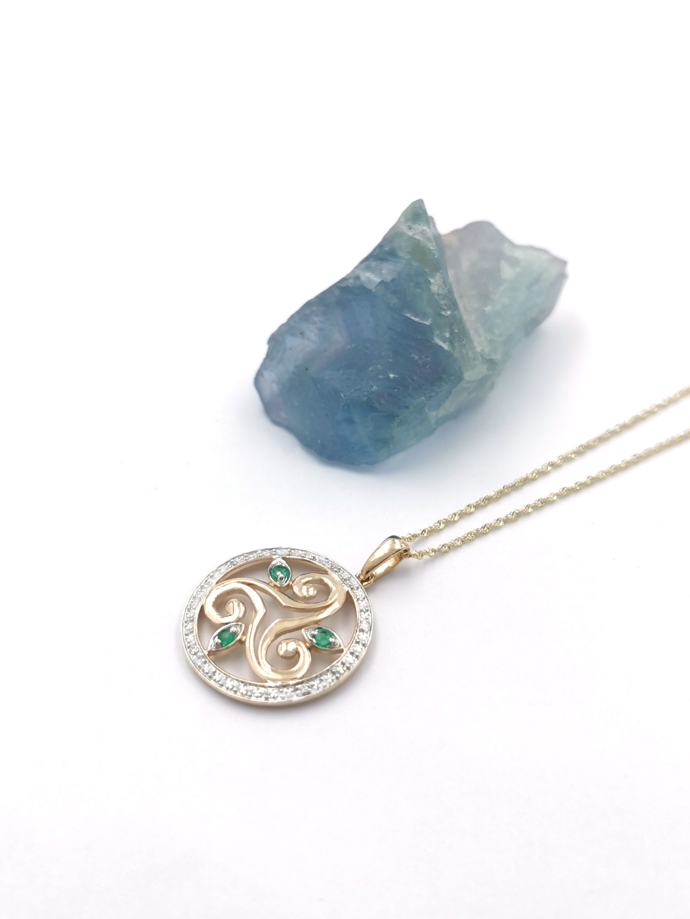 Luxurious 14K Yellow Gold Triskele Necklace For Women. Pictured Flat.