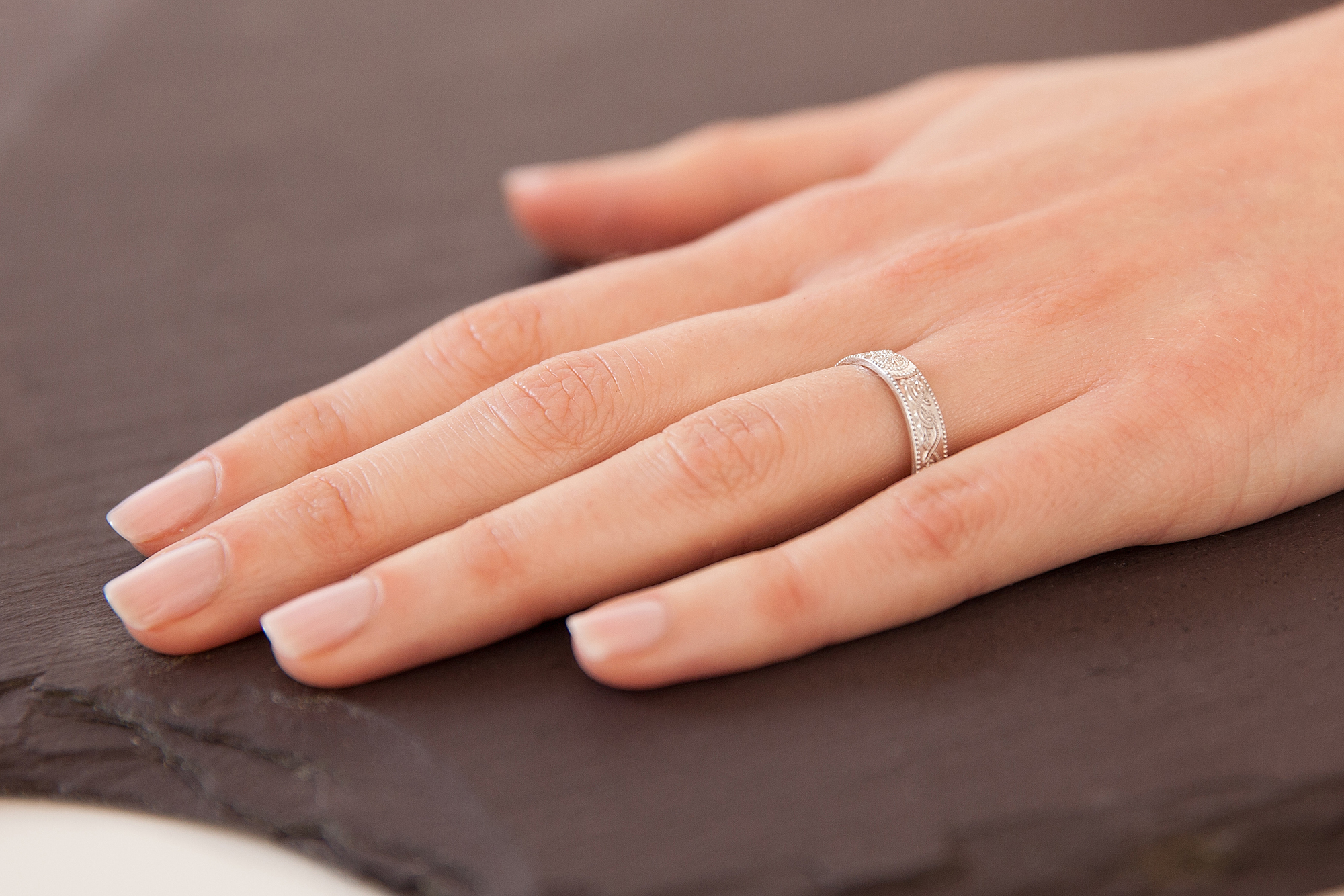 Irish Platinum Celtic Warrior & Celtic Knot 6.0mm Ring With a Florentine Finish For Women - Model Photo