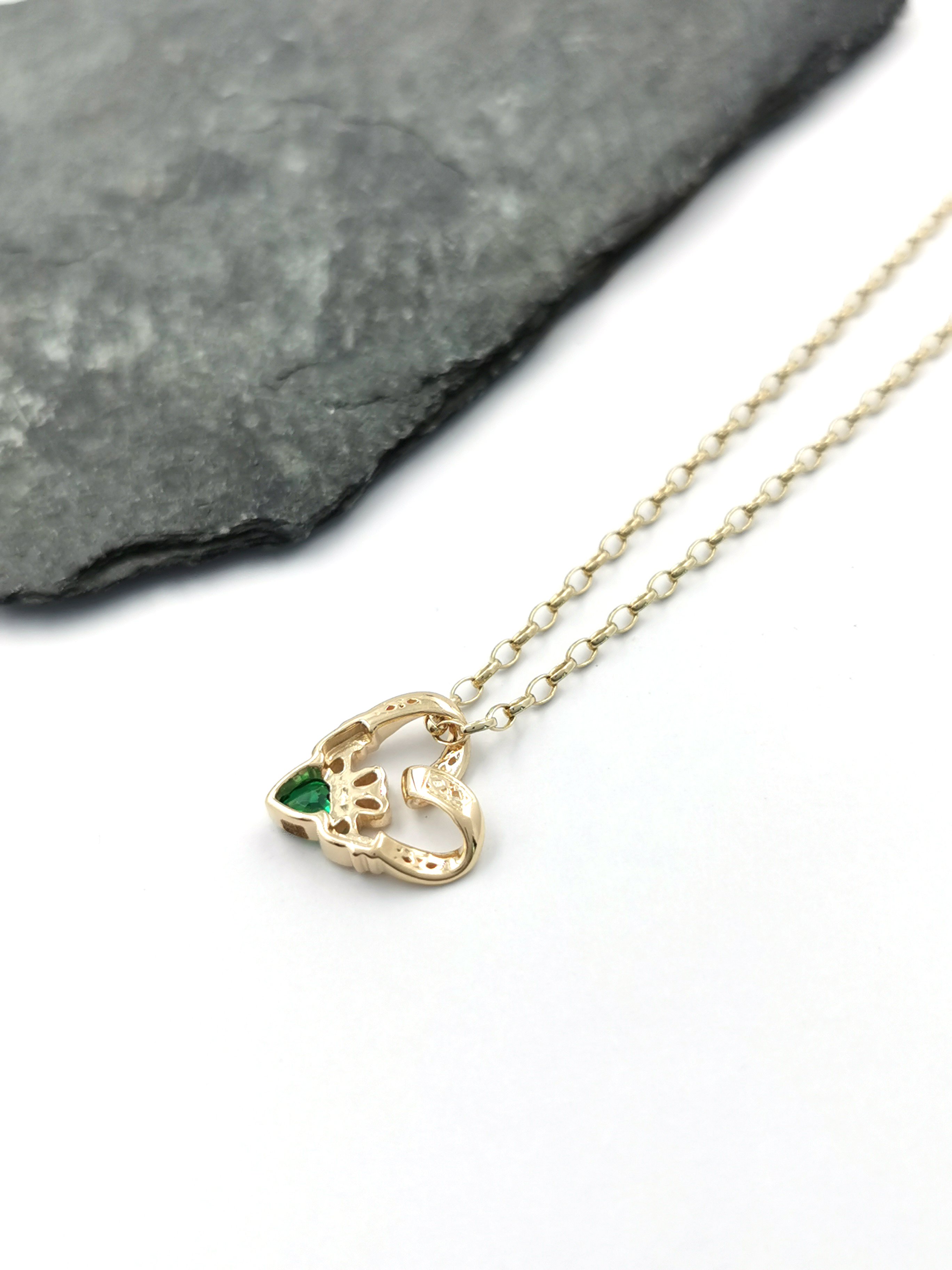 Gorgeous 9K Yellow Gold Claddagh Necklace For Women. Pictured Flat.
