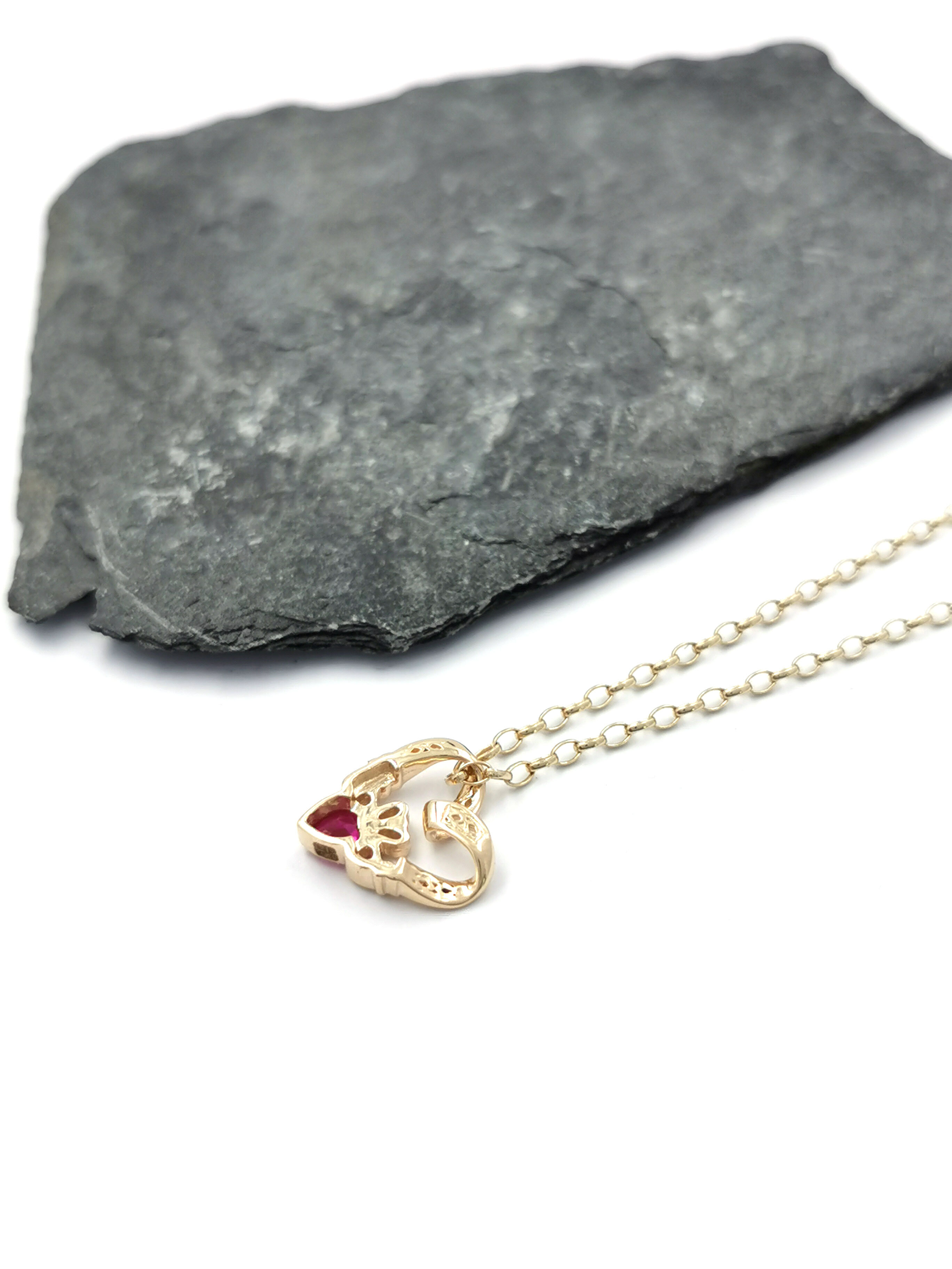 Gorgeous Yellow Gold Claddagh Necklace For Women. Pictured Flat.