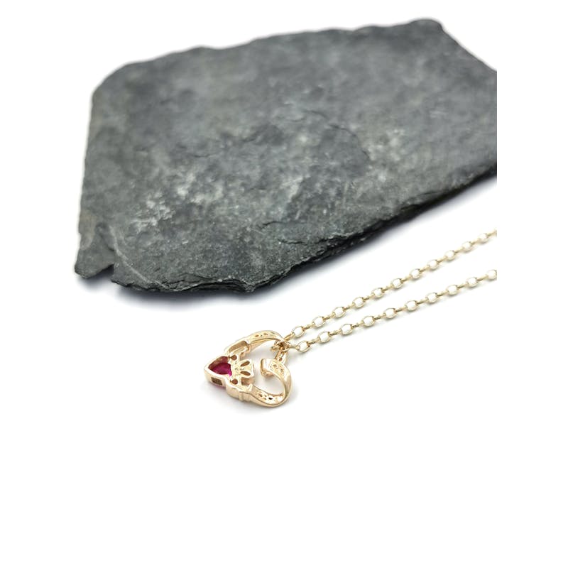 Gorgeous Yellow Gold Claddagh Necklace For Women. Pictured Flat.