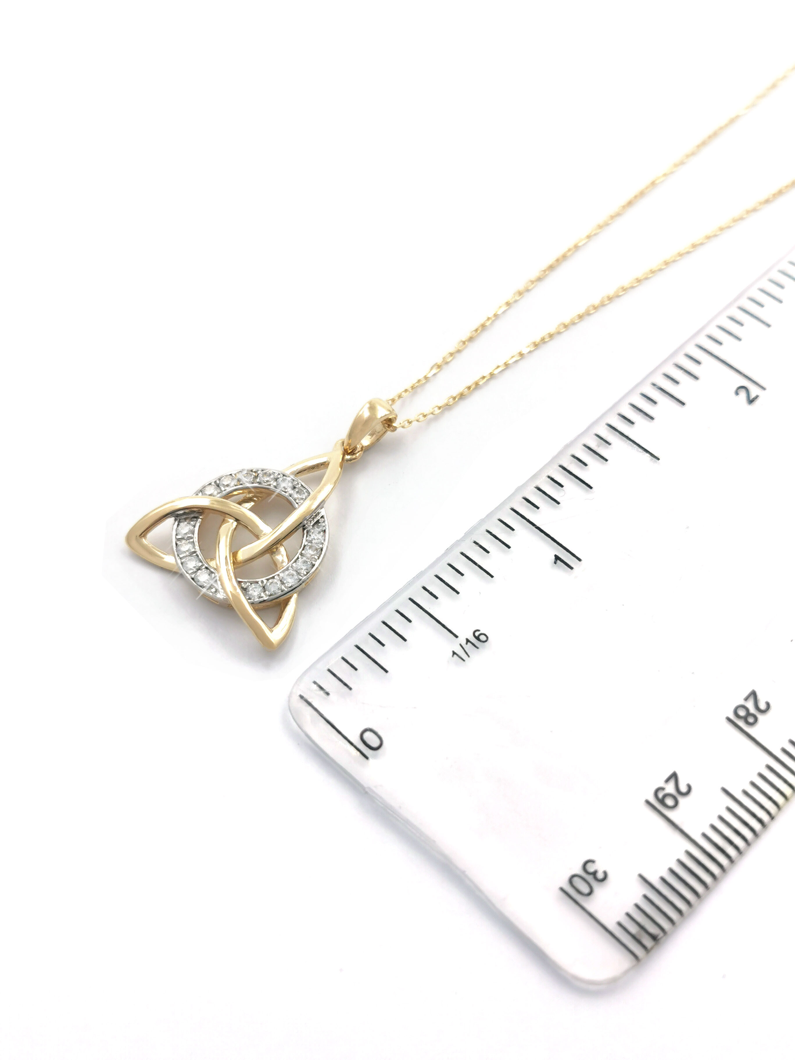 Womens Celtic Knot & Trinity Knot Necklace in Yellow Gold & White Gold. Picture For Scale.