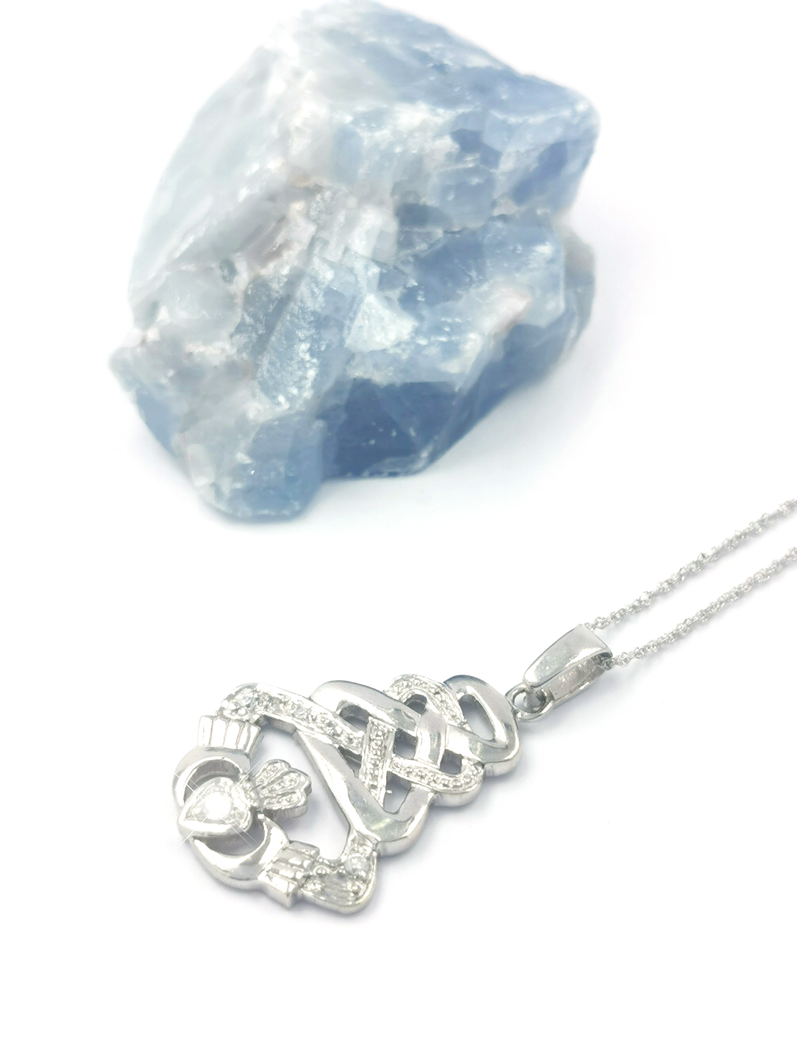 Real 9K White Gold Claddagh Necklace For Women. Pictured Flat.