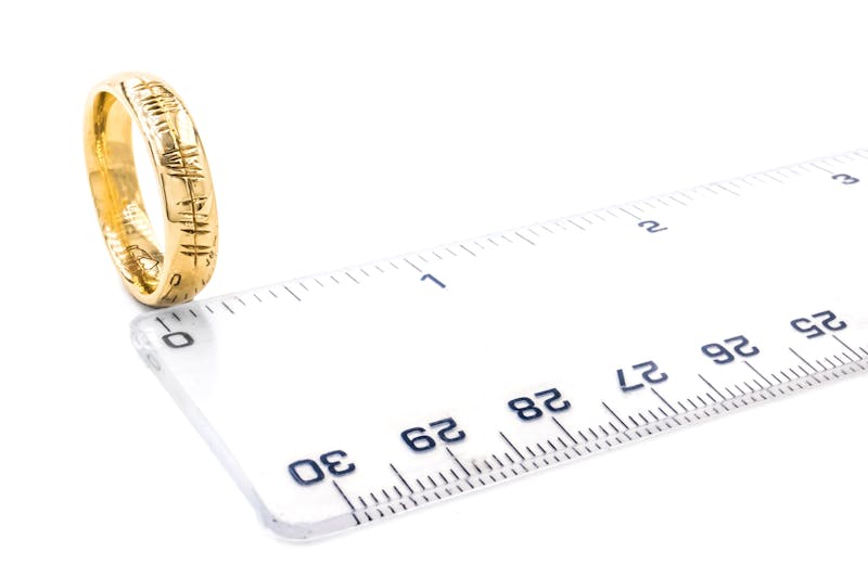 Engravable Yellow Gold Ogham Wedding Ring With a Polished Finish