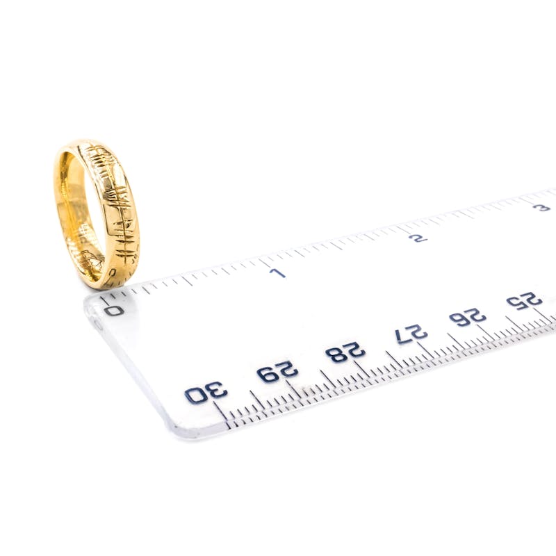Engravable Yellow Gold Ogham Wedding Ring With a Polished Finish