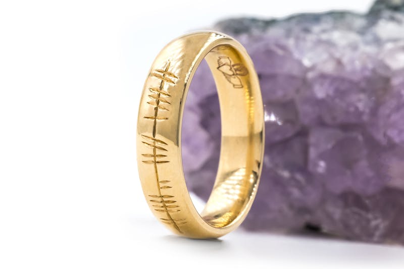 Luxurious Yellow Gold Ogham Ring With a Polished Finish. Side View.