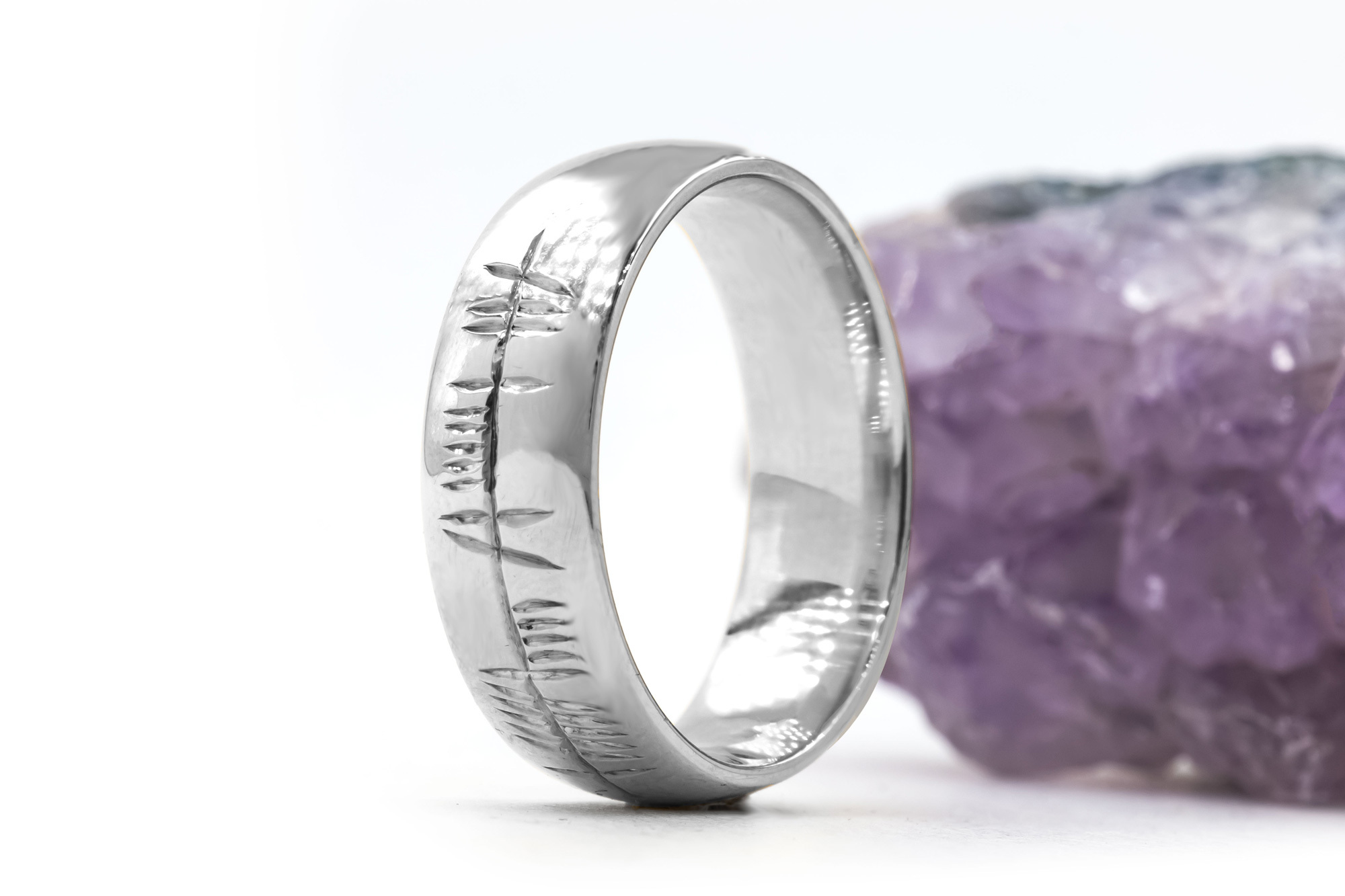 Engravable Platinum 950 Ogham 7.0mm Ring With a Polished Finish. Side View.