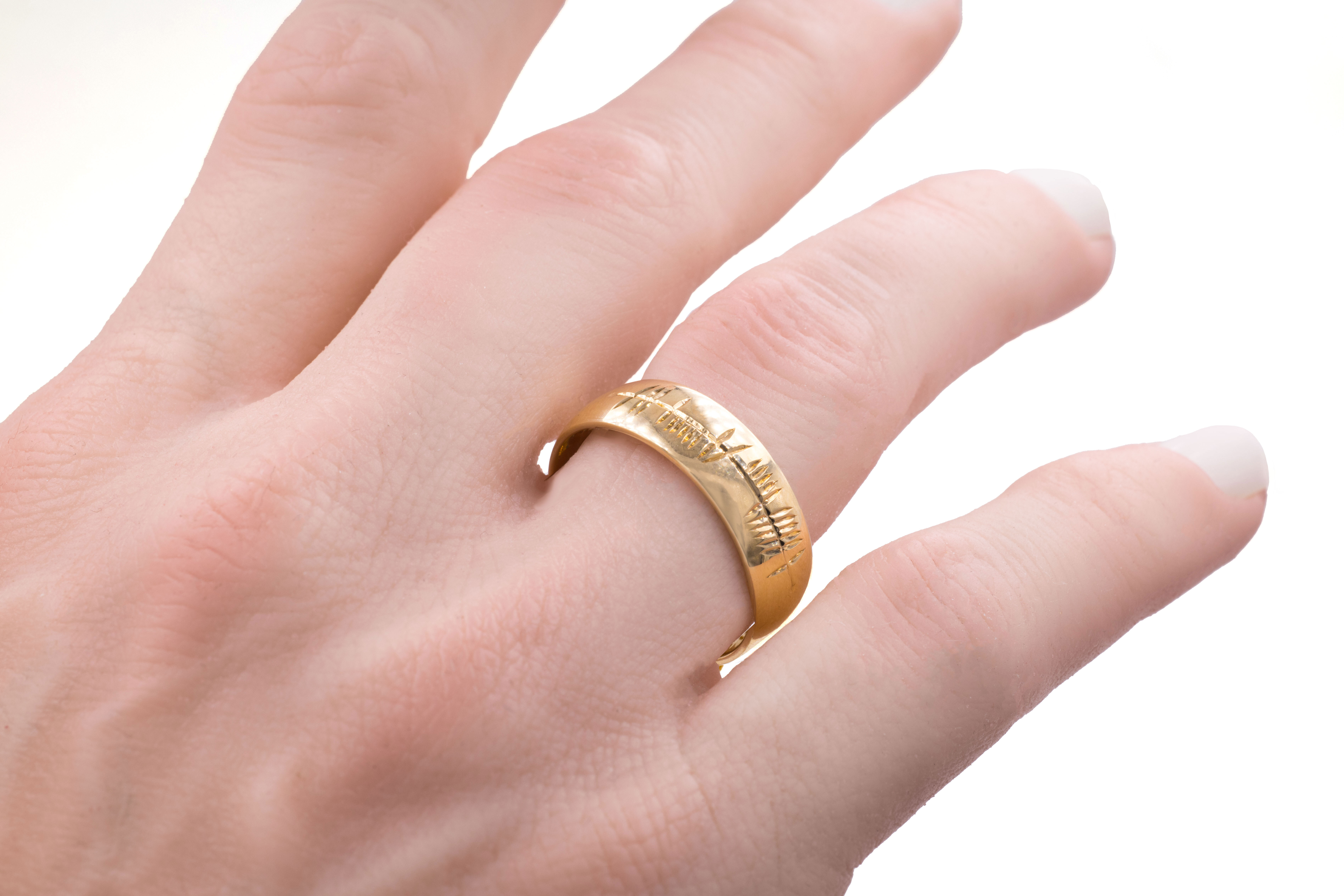 Authentic Yellow Gold Engravable Ogham 5.0mm Ring With a Polished Finish - Model Photo