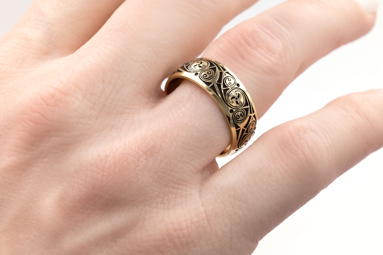 Authentic Yellow Gold Triskele 5.0mm Ring With a Cerin Finish - Model Photo