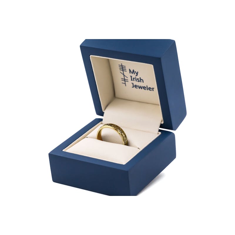 Luxurious Yellow Gold Triskele 5.0mm Ring With a Cerin Finish. In Luxury Packaging.