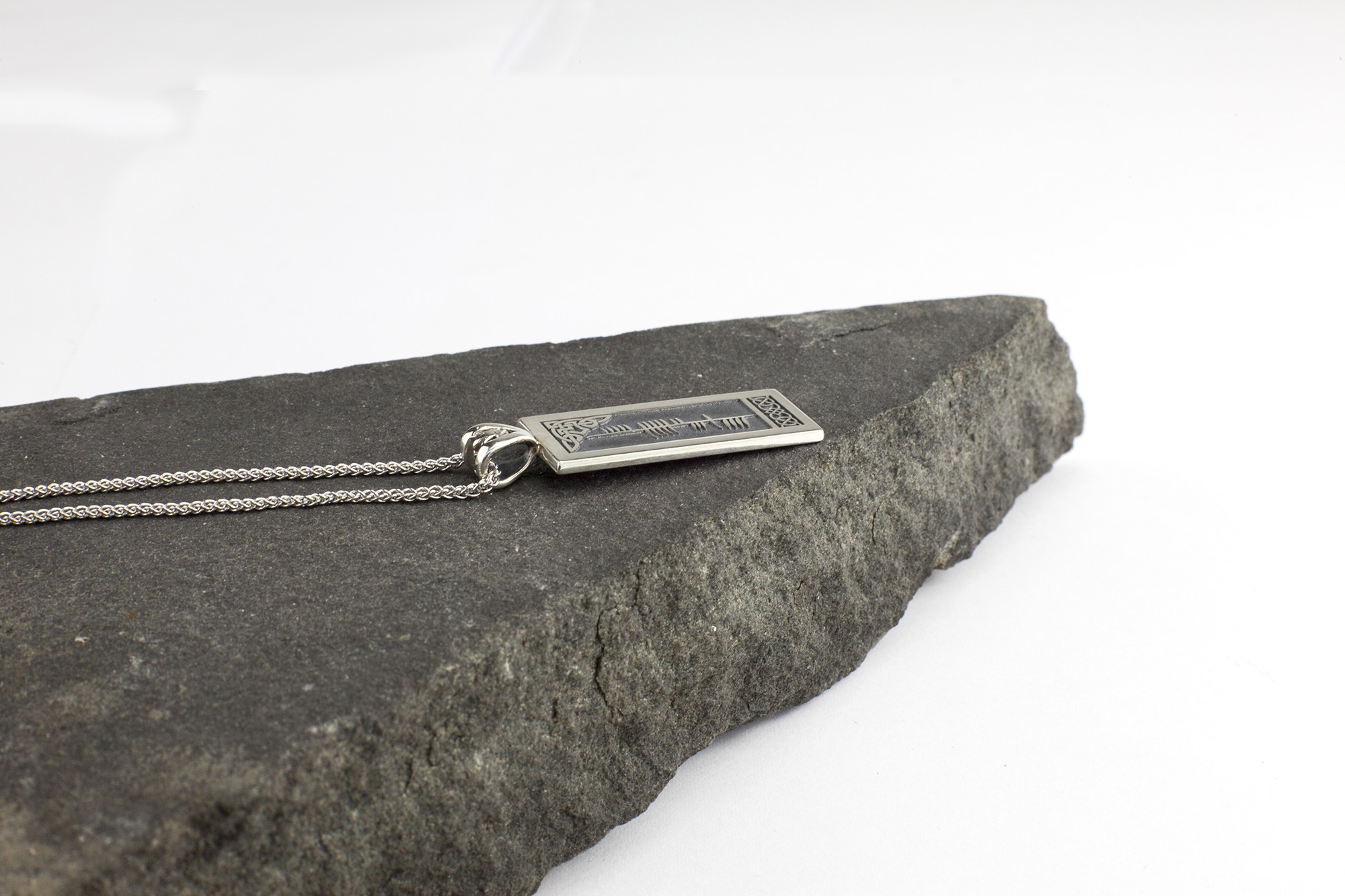 Striking Sterling Silver Personalisable Ogham Necklace With a Oxidised Finish. Side View.