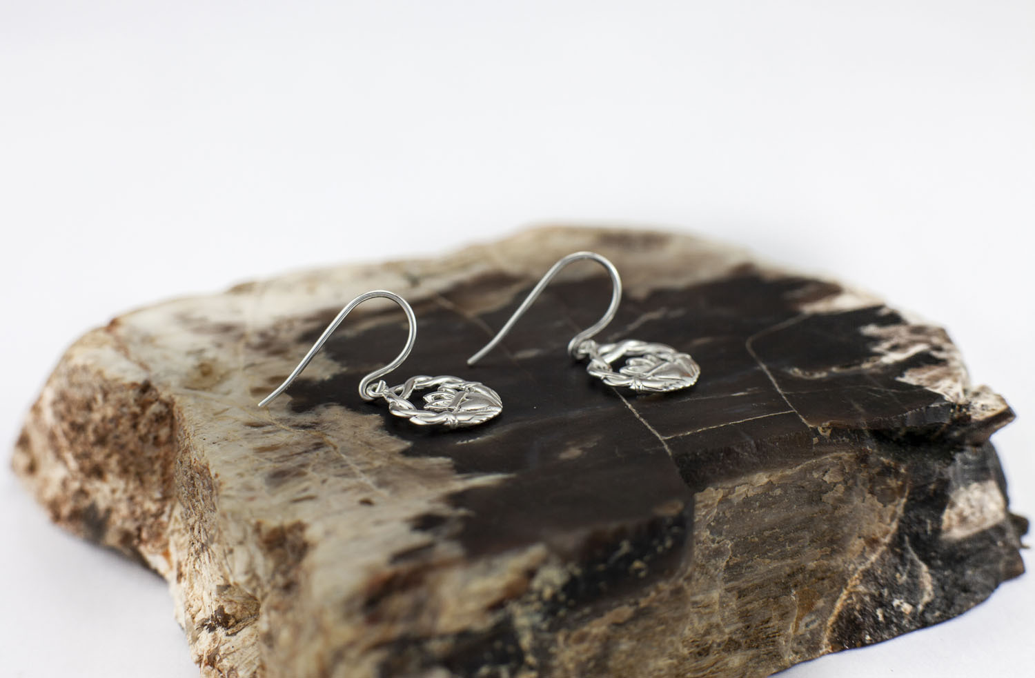 Small Womens Genuine Sterling Silver Claddagh Earrings. Pictured Flat.
