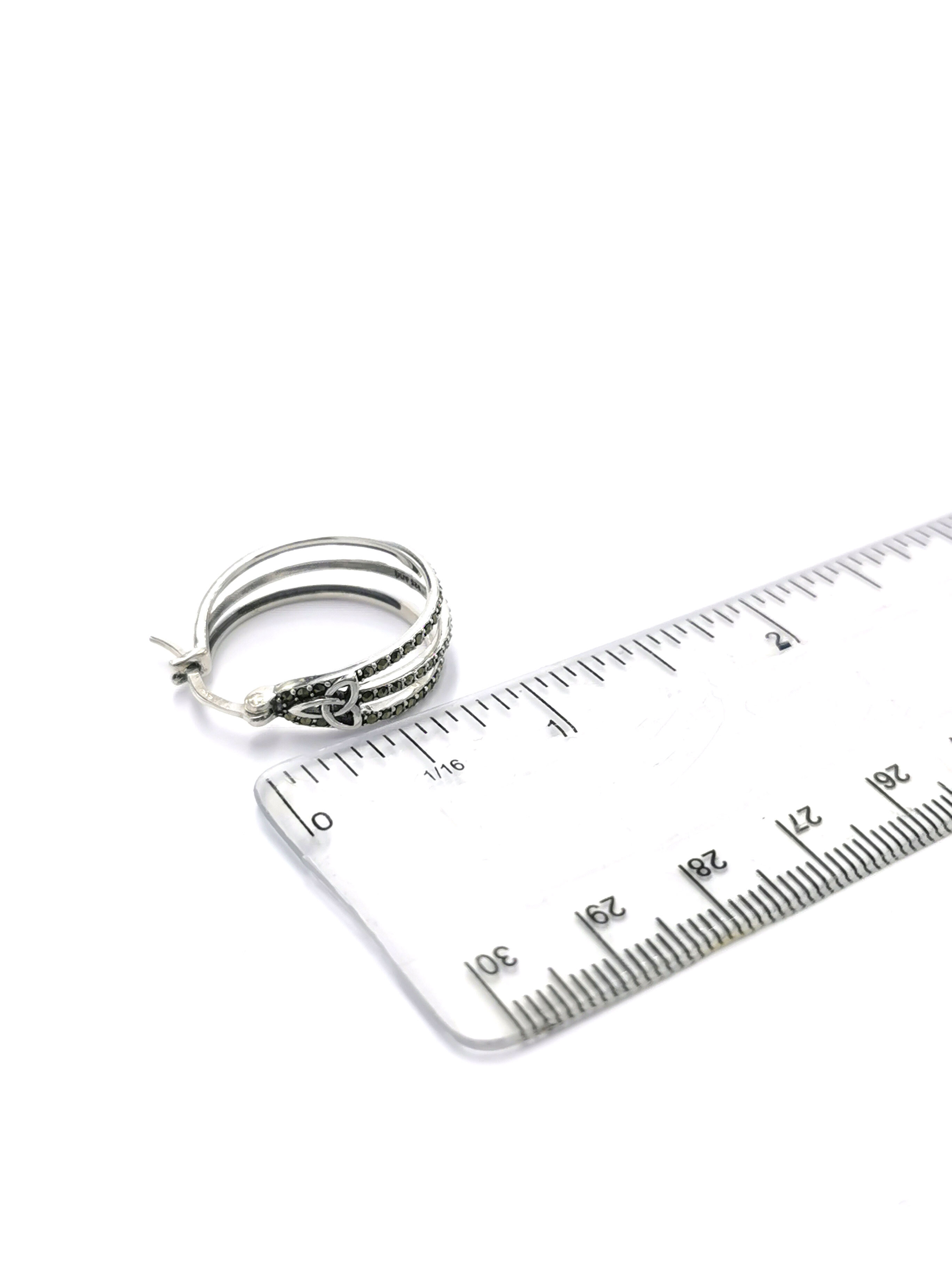 Womens Trinity Knot Earrings in Sterling Silver. Picture For Scale.