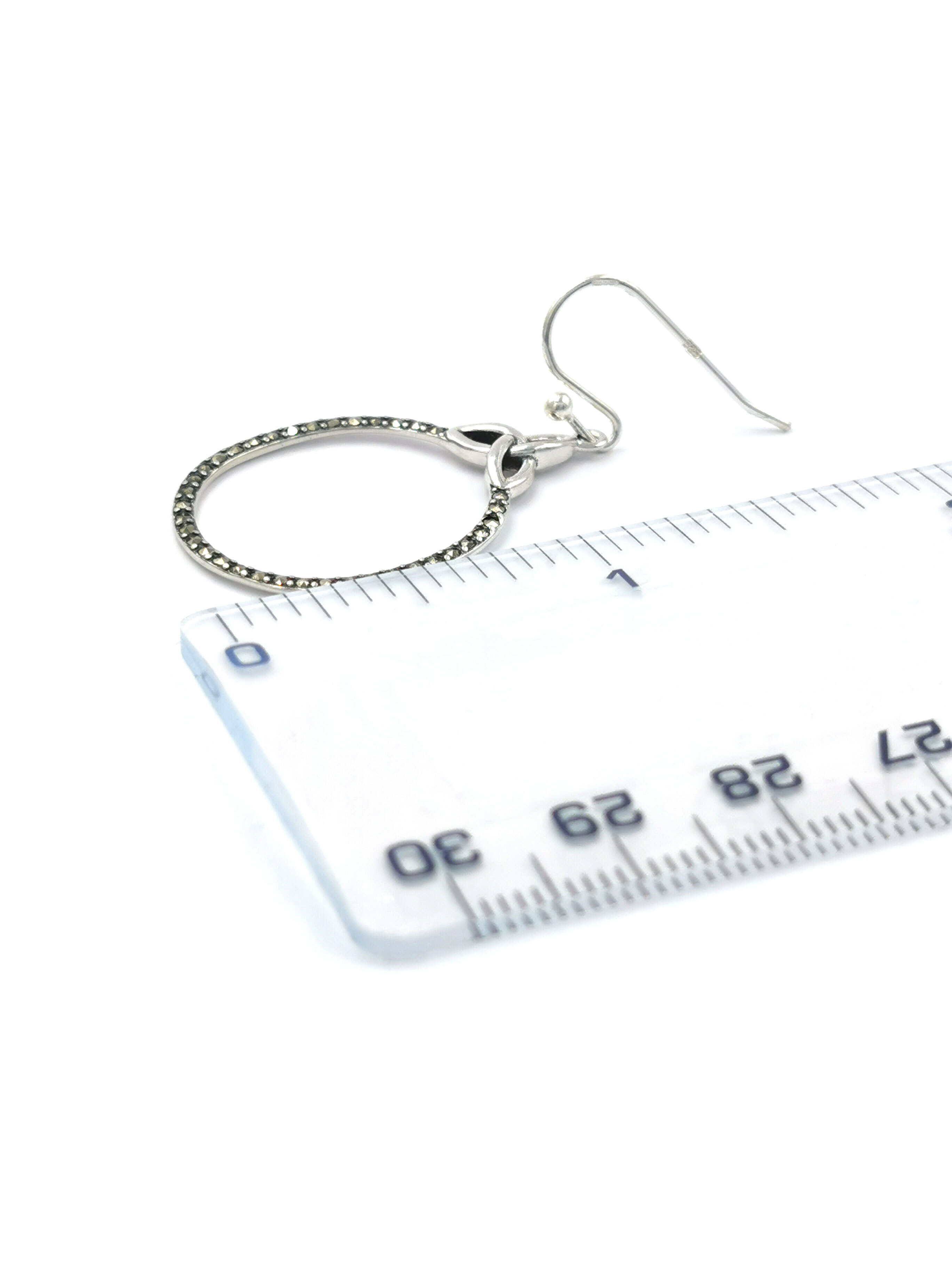 Authentic Sterling Silver Trinity Knot Earrings For Women With a Polished Finish. Picture For Scale.