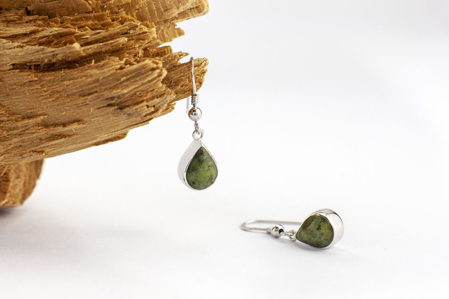 Attractive Sterling Silver Connemara Marble Earrings For Women. Pictured Flat.