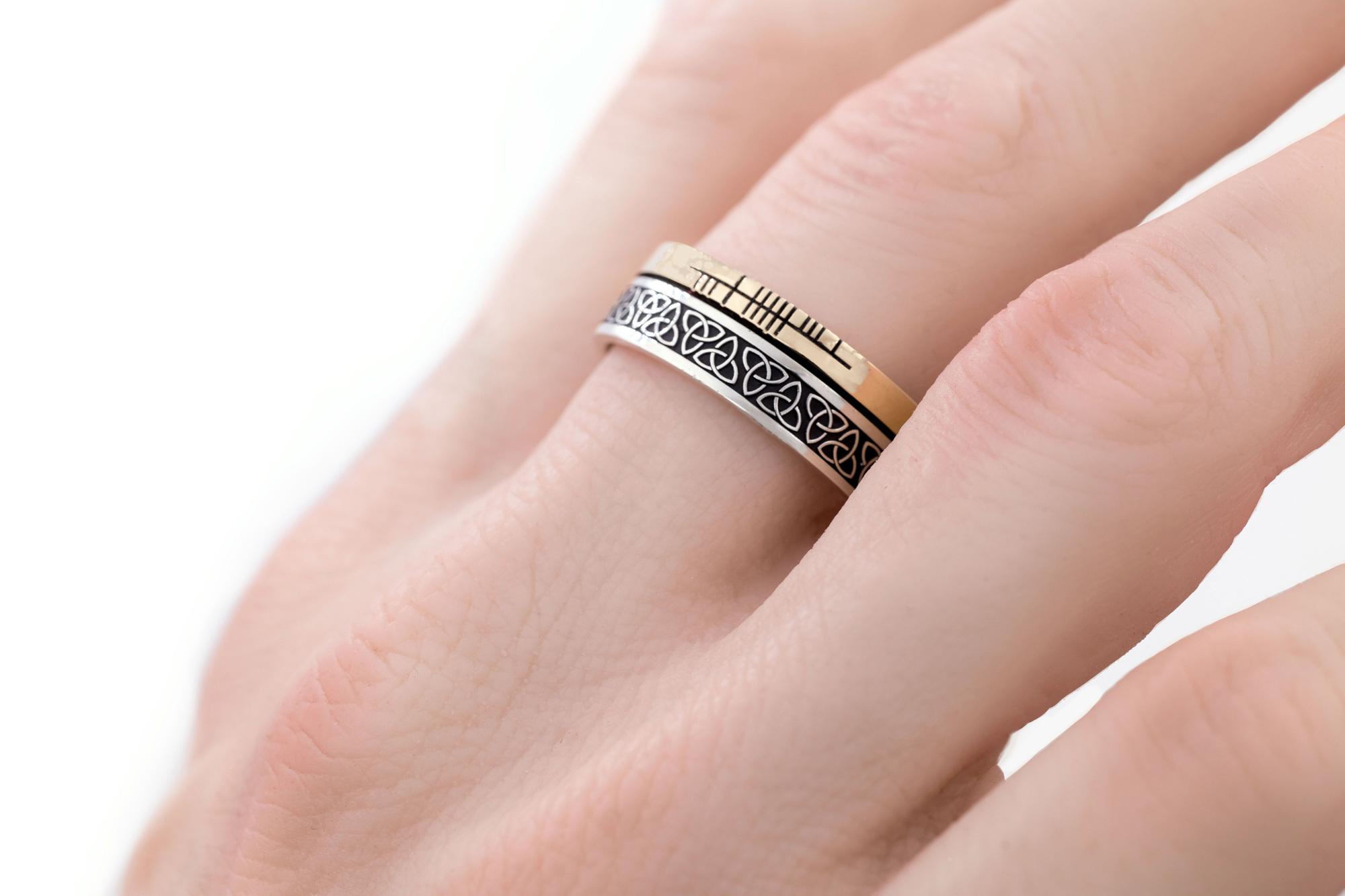 Striking Sterling Silver & 10K Yellow Gold Ogham & Trinity Knot Wedding Ring With a Oxidized Finish - Model Photo