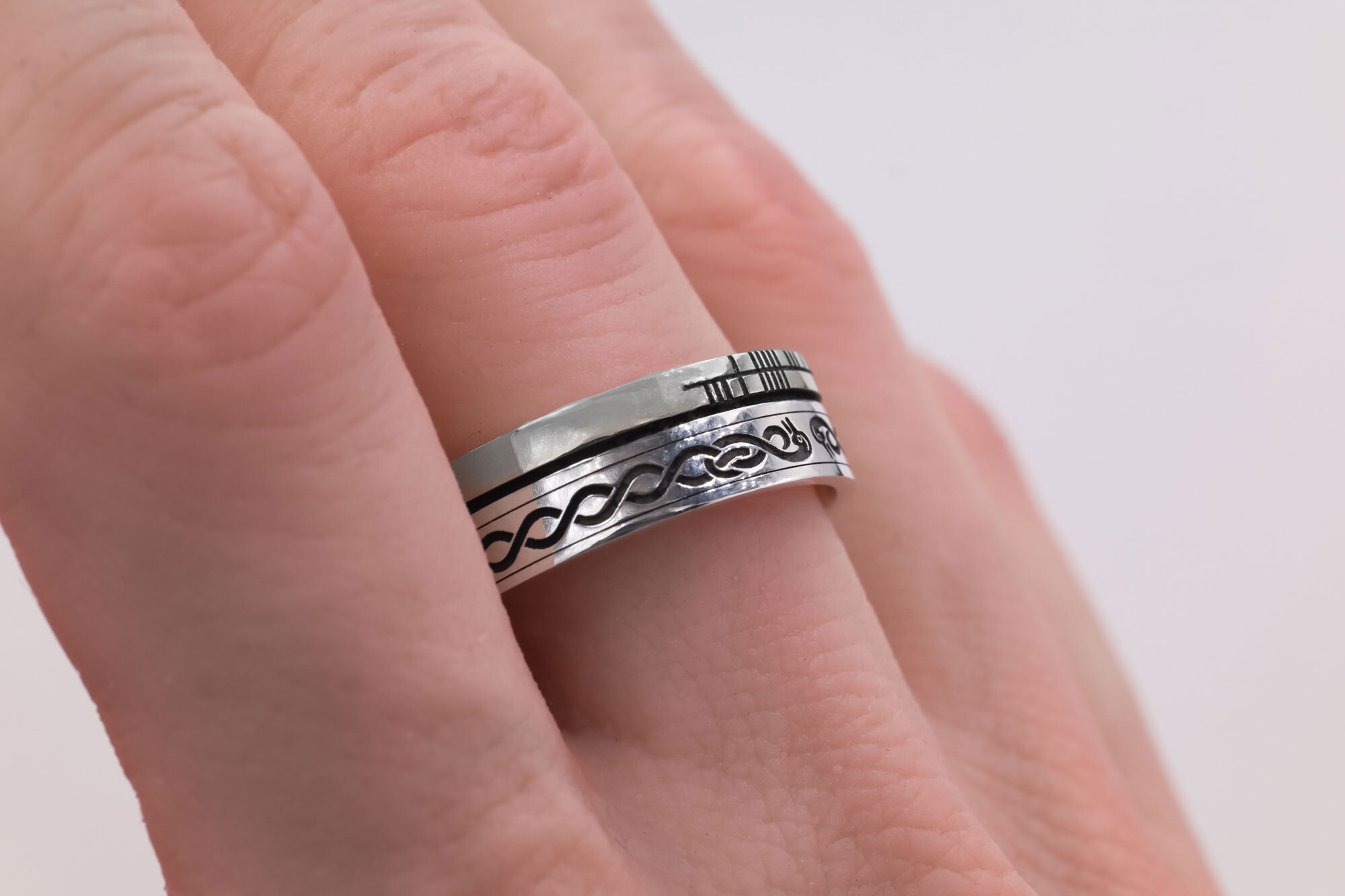 Ogham Wedding Ring in Sterling Silver With a Oxidised Finish - Model Photo