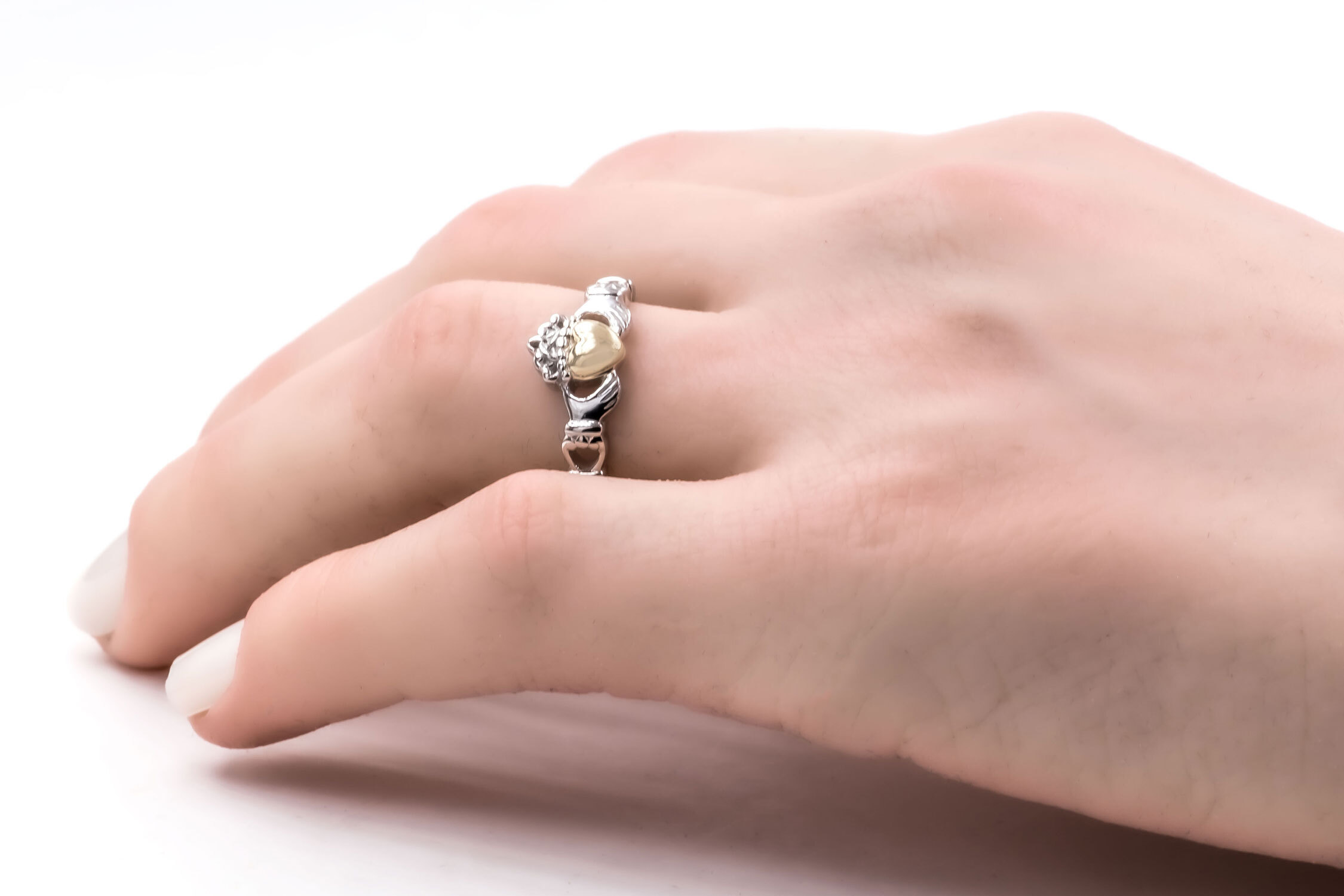 Silver gold heart claddagh ring hand model